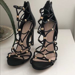 Aldo black and gold clasp heels